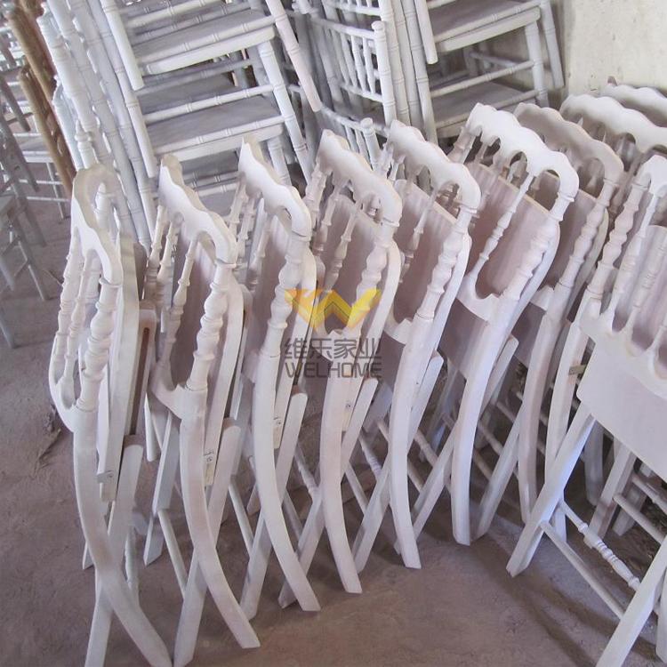 White wooden napoleon folding chair with cushion for wedding/event